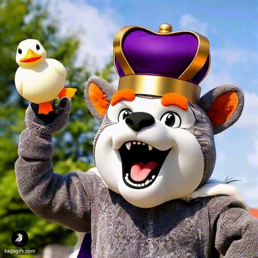 Bulldog mascot with gray fur, white face, black nose, and orange ears wearing a gold crown with purple heart, mouth wide open and inhaling a duck with swift motion.