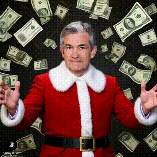 Jerome Powell wearing a red Santa costume with white fur trim, gray hair, composed expression, arms outstretched as dollar bills cascade down around him in a dynamic shower.