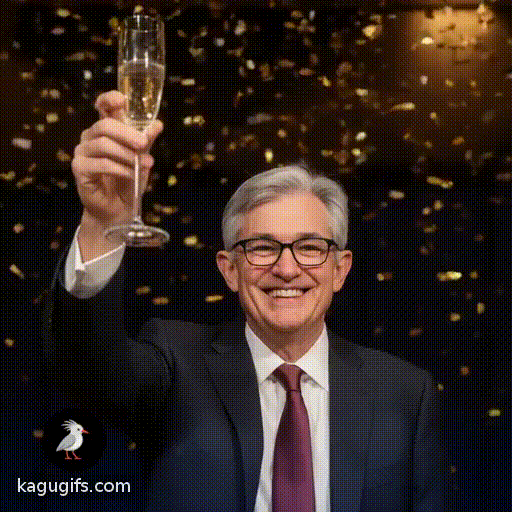 Jerome Powell in dark suit and burgundy tie, raising a champagne glass and smiling warmly while celebrating New Year's Eve, silver-gray hair, black-rimmed glasses, festive confetti falling around him as he toasts joyfully.