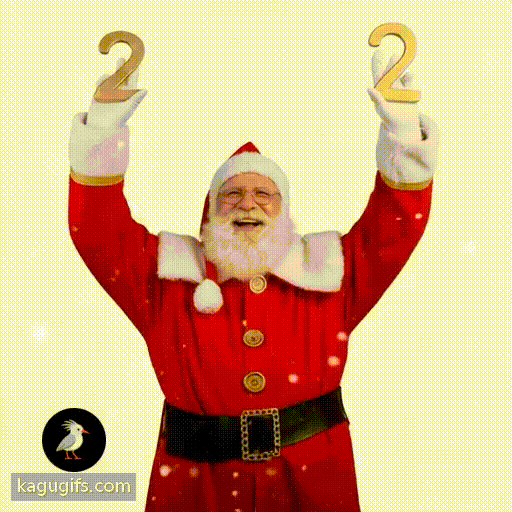 Santa with a full white beard and glasses, wearing a red suit with white fur trim and a red hat, holding up the number two with both hands raised cheerfully against a snowy background.