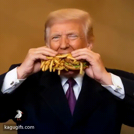 Donald Trump with blonde swept-back hair, tan complexion, wearing a dark navy suit with white dress shirt and burgundy tie, energetically shoveling McDonald's fries and burgers into his mouth with both hands in rapid animated movements.