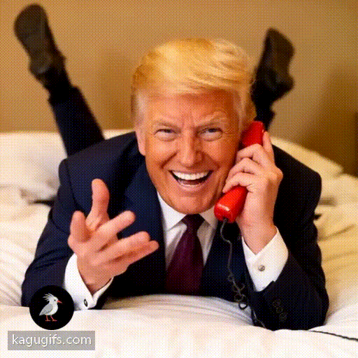 Donald Trump with distinctive golden-blonde hair and business suit laying down face on a bed facing towards the camera with his legs in the air behind him talking happily on a red telephone, cheerful expression, animated gesturing.
